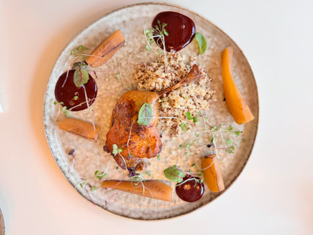 lamb leg with quinoa with caramelized pear and lingonberry sauce in the restaurant. High quality photoの写真素材