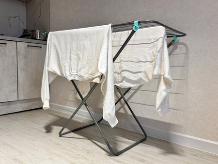 White clothes are dried on the dryer at home. High quality photoの写真素材