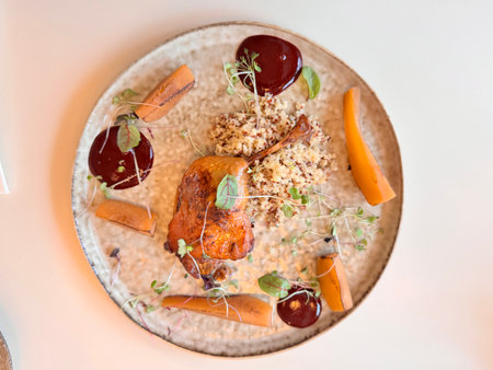 lamb leg with quinoa with caramelized pear and lingonberry sauce. High quality photoの写真素材