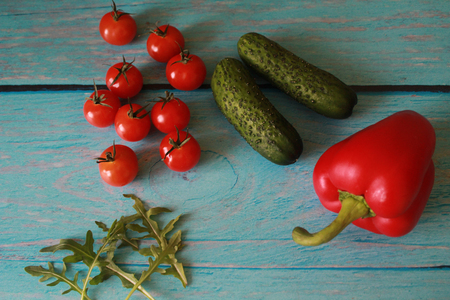 Shabby chic. Cherry tomatoes on white background. Fresh vegetables on a table. Horizontal photo.の写真素材