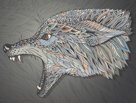 Patterned head of the wolf. Tribal ethnic totem, tattoo design. Hand drawn abstract artwork in graphic style, vector illustration. It may be used for design of a t-shirt, bag, postcard, a poster and so on.のイラスト素材
