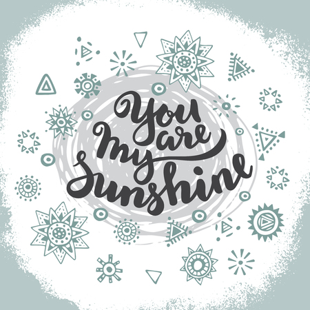 Handwritten quote You are my sunshine on hand drawn graphic ethnic background with doodle suns. Vector illustration for poster or card design.のイラスト素材