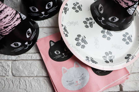 Pink plate with kittens on a lightの写真素材