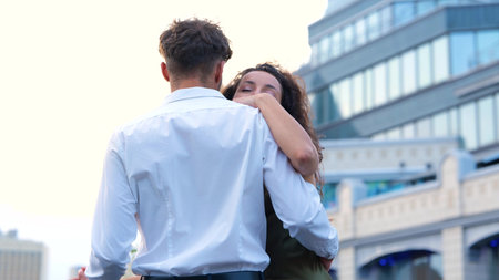 Close up portrait of happy young couple in love celebrating anniversary dancing on rooftop in city....