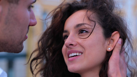 Close up shot of happy young couple gentle man and beautiful woman looking at each other in the...