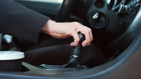 Lady in personal automobile driving, starting trip