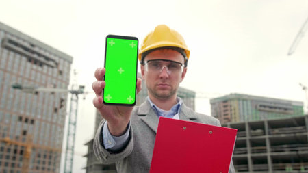 Portrait of foreman working outside on siteの写真素材