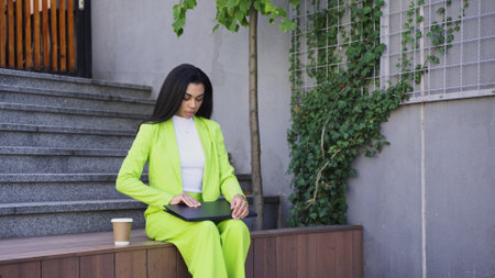 Professional female solve business task via computerの写真素材