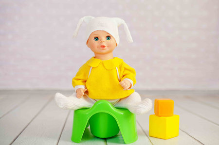 Potty training concept using a doll and toy pottyの写真素材