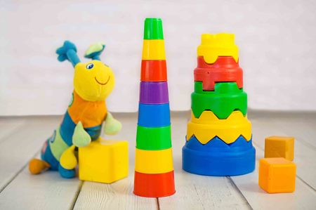 colorful baby toys on wooden backgroundの写真素材