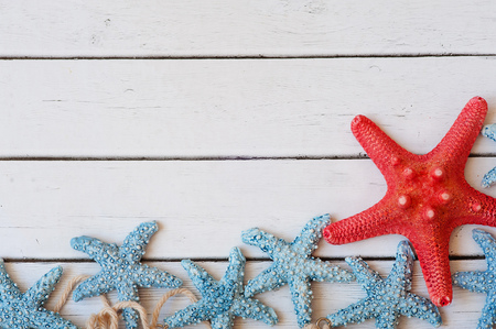 Sea travel frame decor with seashells and rope over wooden backgroundの写真素材