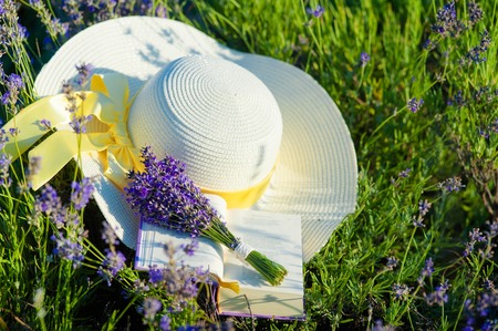 Lavender bunch and straw hatの写真素材