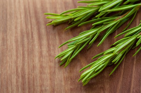 Organic bunch of fresh rosemary on the tableの写真素材