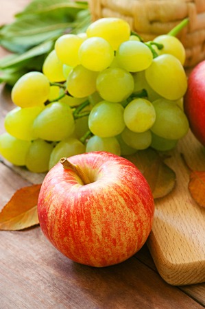 Autumn nature concept. Fall fruit and vegetables on wood. Thanksgiving dinnerの写真素材