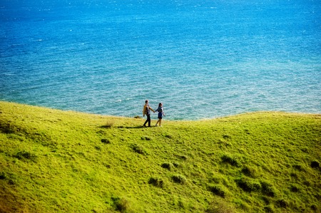 Young couple in love outdoor. They are smiling and looking at each other. happy lifestyle conceptの写真素材