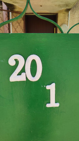 numbers white numbers 20 and 1 on a green background, house, apartment, symbol, designations conditional places. high quality photoの写真素材