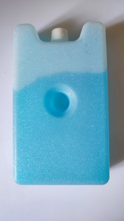 plastic container with blue water for freezing. high quality photo
