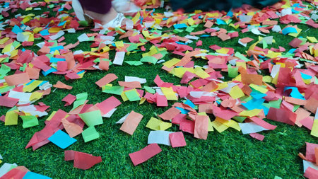 multi-colored paper confetti scattered on the ground on a holiday, bright background. high quality photoの写真素材