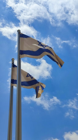 two Israeli flags against the blue sky, white-blue symbol of the country. high quality photoの写真素材