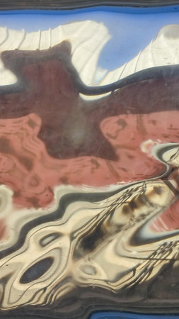square shaped old durable glass with multicolored reflections background