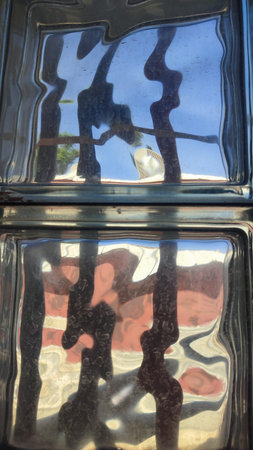 square shaped old durable glass with multicolored reflections backgroundの写真素材