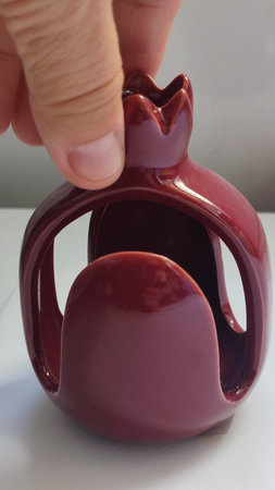 souvenir red pomegranate, napkin stand, object. High quality photoの写真素材