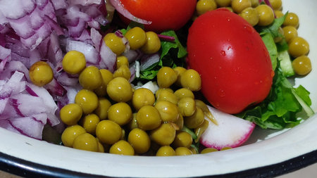 green salad with red onion and peas, food vegetables lunch breakfast. High quality photoの写真素材