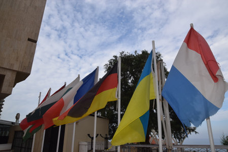 flags of different countries Germany, Ukraine at skyのeditorial素材