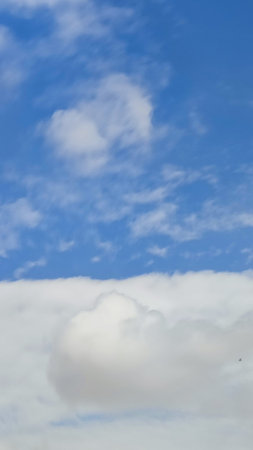 blue sky, white clouds background spring nature weather atmosphere. High quality photo