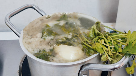 soup broth with parsley in aluminum pan, food lunch dish kitchen cooking. High quality photoの写真素材