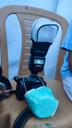 20 April 2024, Beer-Sheva , Israel,Nikon camera and Godox flash, medical mask