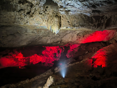 tools inside Kumistavi cave,nature park unique reserve, tourism, red light earth stalactites stalagmites dark closed place space tourist center object travel near Tskaltuboの写真素材