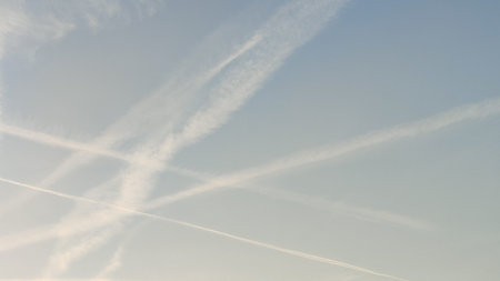 blue sky, white stripes, traces of airplane flight, air background abstract. High quality photo