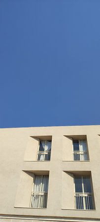 modern new residential building with windows, architecture, blue sky. High quality photo