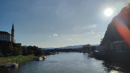 River sunlight castle blue sky landscape background summer day evening landscape city center nature...