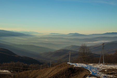 Mountains during the afterglow with the fog