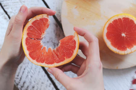 Citrus. Delicious grapefruit on the tableの写真素材