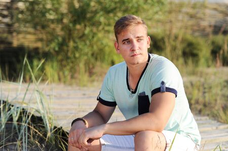 Handsome guy on the beachの写真素材