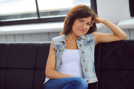 Beautiful girl on the sofaの写真素材