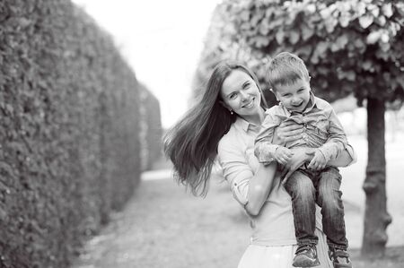 Beautiful mother and her child in the parkの写真素材