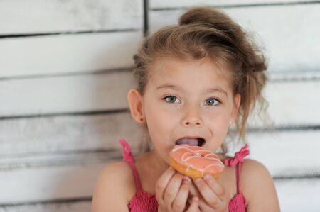 Child. Cute girl with a donutの写真素材