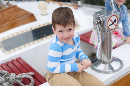 Young boy on the boatの写真素材