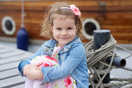 Cute girl on a pierの写真素材