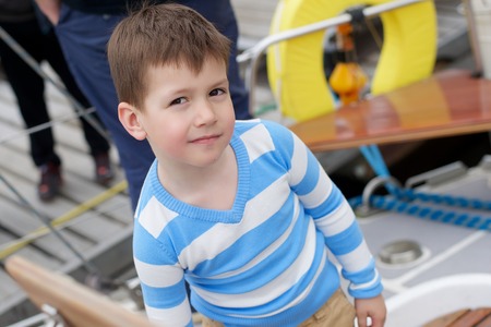 Young boy on the boatの写真素材