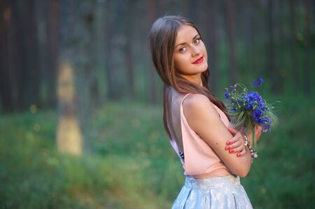 Summertime, midsummer. Cute girl outdoorの写真素材