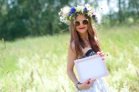 Summertime, midsummer. Cute girl outdoorの写真素材