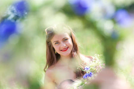 Summertime, midsummer. Cute girl outdoorの写真素材