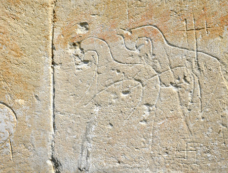 Old wall with ancient drawings