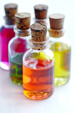 Bottles with basics oils isolated on whiteの写真素材