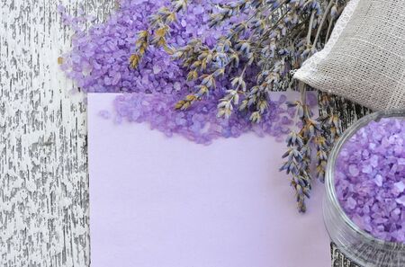 Lavender flower, salt and blank paper on a wooden backgroundの写真素材